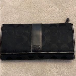 Black Coach wallet with Coach logo in cloth